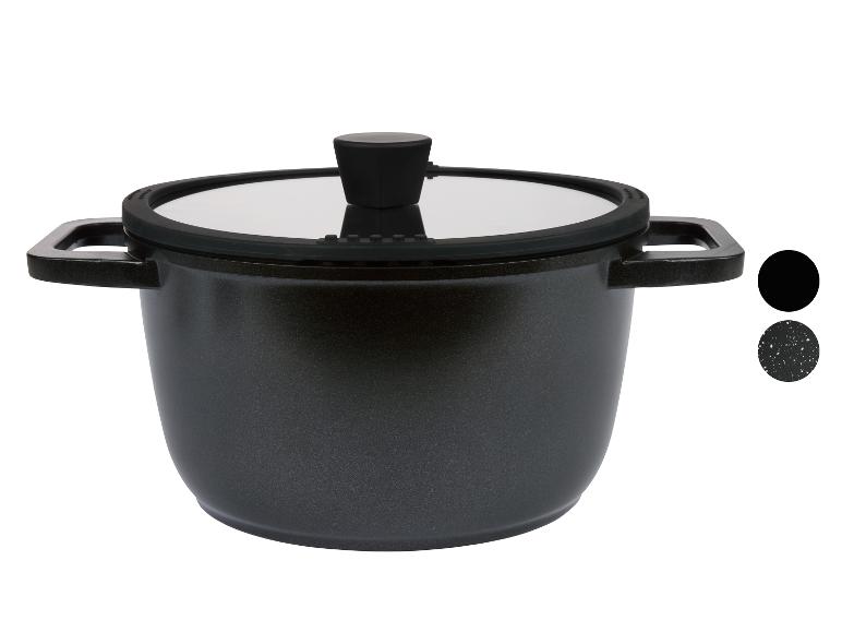 Casseroles noires avec couvercle en verre.