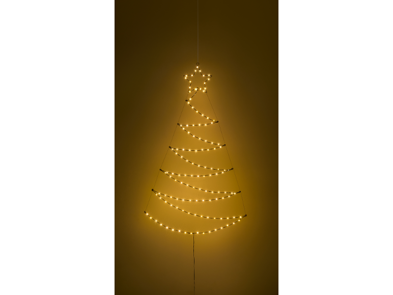 Décoration murale lumineuse en forme de sapin de Noël avec une étoile, brillant chaleureusement sur fond sombre.