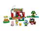 Un ensemble LEGO Animal Crossing avec une maison, des personnages et des accessoires de couture.