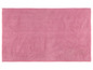 Un tapis de bain rose avec une texture douce.