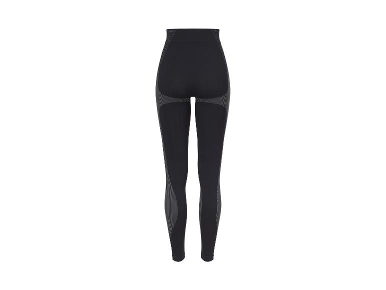 Legging de sport noir sans couture avec détails rayés gris.