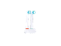 Deux têtes de brosse à dents électrique Oral-B dans un support de charge.