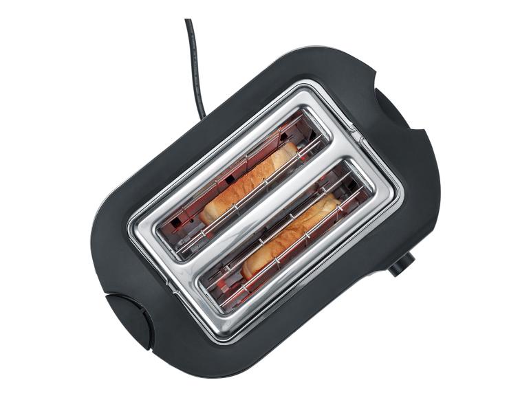 Grille-pain noir avec deux tranches de pain grillé à l'intérieur, vu de dessus