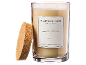 Bougie parfumée dans un pot en verre avec un couvercle en liège, étiquetée 'Sublime Patchouli'.