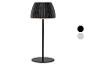 Lampe de table noire avec abat-jour plissé et deux options de couleur.