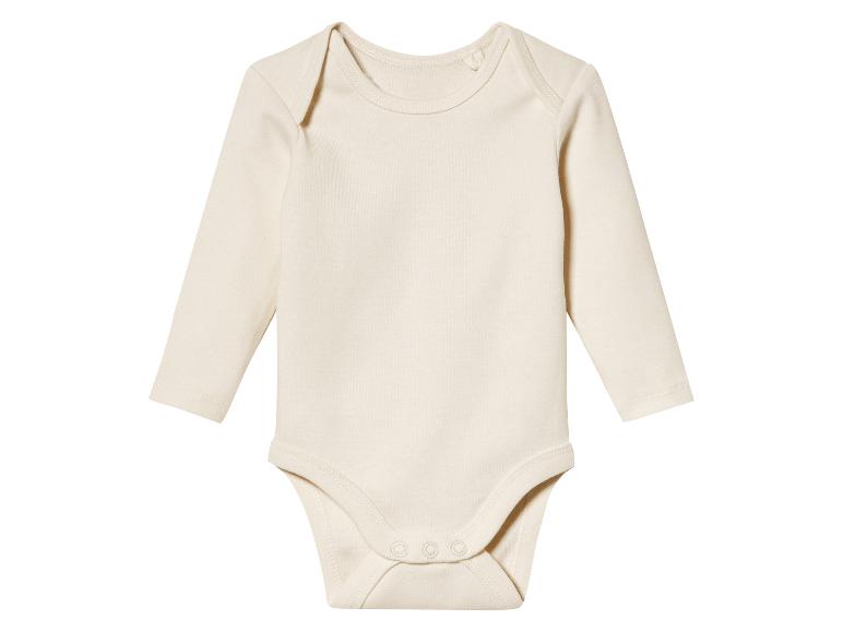 Un body bébé blanc à manches longues.
