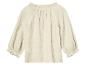 Chemise en mousseline beige à manches bouffantes.