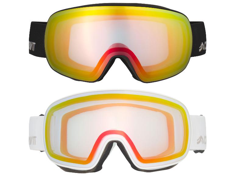 Masques de ski Anon noirs et blancs avec des verres orange et jaunes.