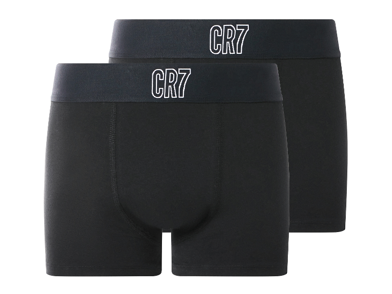 Deux boxers noirs avec des ceintures élastiques foncées et des logos 'CR7' blancs.