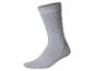 Chaussette unie en coton gris sur fond blanc.