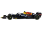 Voiture de course miniature noire et jaune avec des autocollants de sponsors.