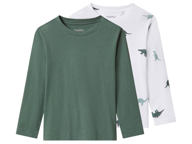 Deux t-shirts à manches longues Lupilu pour enfants: un vert foncé et un blanc à dinosaures.