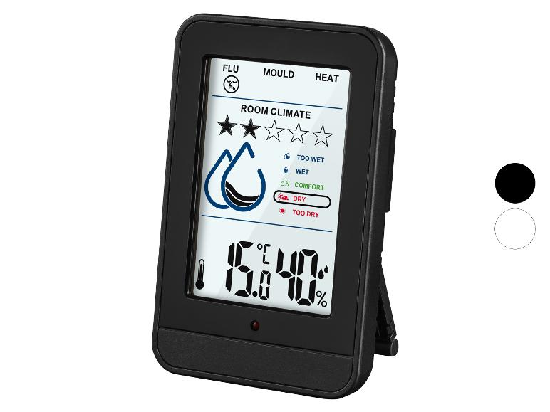 Thermomètre et hygromètre numérique noir avec affichage du climat ambiant.