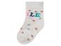 Chaussette blanche avec des cœurs et l'inscription 'Smile everyday'.