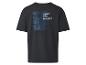 T-shirt noir avec inscription « Enjoy the Moment ».