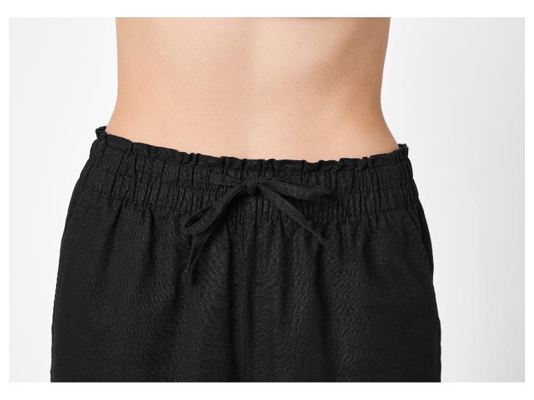 Pantalon noir pour femme avec taille élastique et cordon de serrage.