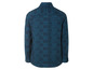 Une chemise à manches longues bleu foncé avec un motif géométrique.
