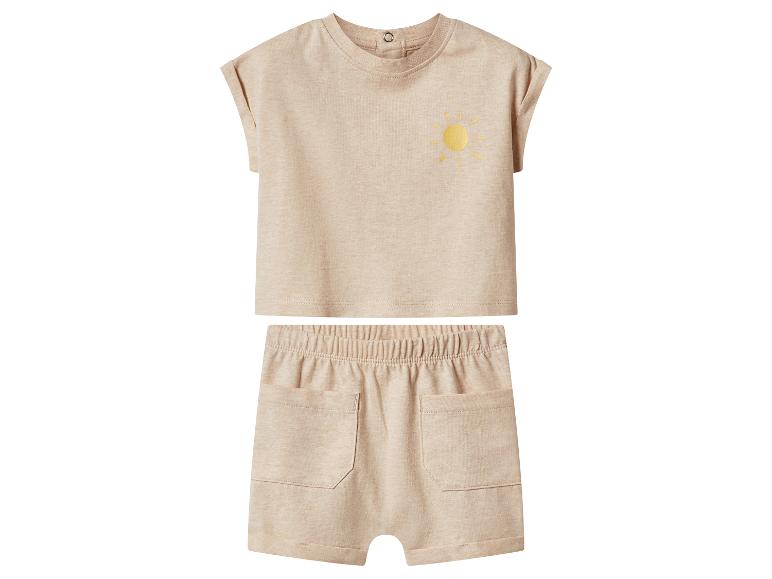 Ensemble enfant beige avec t-shirt à manches courtes motif soleil et short.