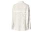 Vue arrière d'une chemise blanche à manches longues en tissu texturé.