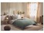 Drap-housse en jersey LIVARNO home avec lin sur un lit dans une chambre chaleureuse