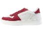 Des baskets blanches avec des détails rouges de U.S. Grand Polo.