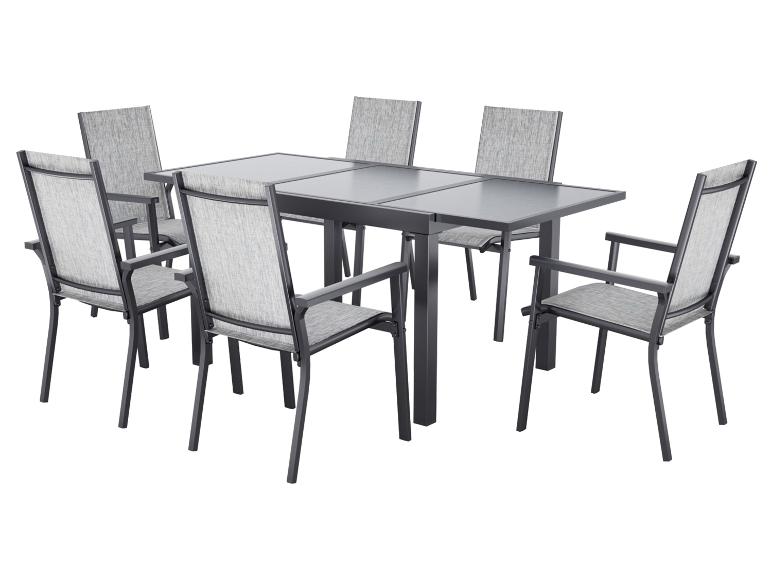 Ensemble de mobilier de jardin: table rectangulaire et six chaises avec sièges gris.