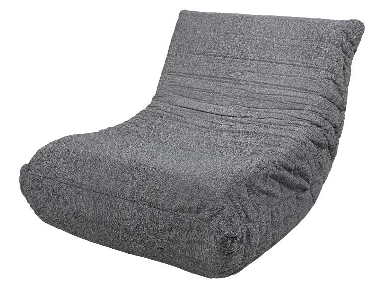 Fauteuil lounge gris texturé avec dossier plissé.