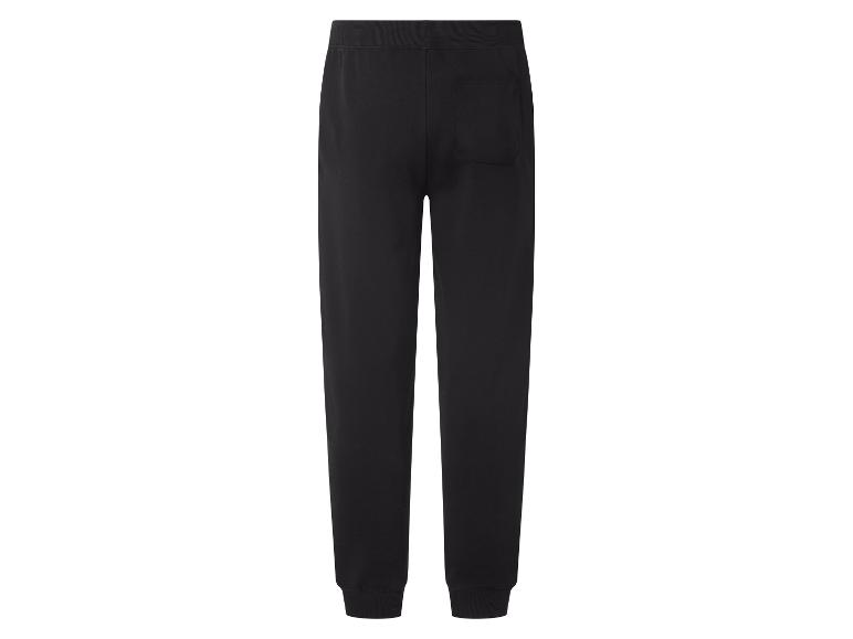 Pantalon de jogging noir avec taille élastique et chevilles resserrées, vue arrière.