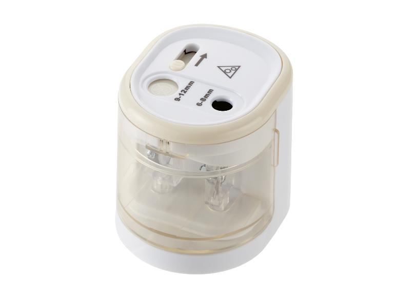 Taille-crayon électrique blanc et transparent avec deux ouvertures pour crayons de 6-8mm et 9-12mm.