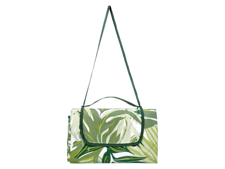 Couverture de pique-nique pliable avec motif de feuilles vertes et sangle de transport.