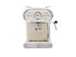 Machine à expresso beige au design rétro avec des détails métalliques.