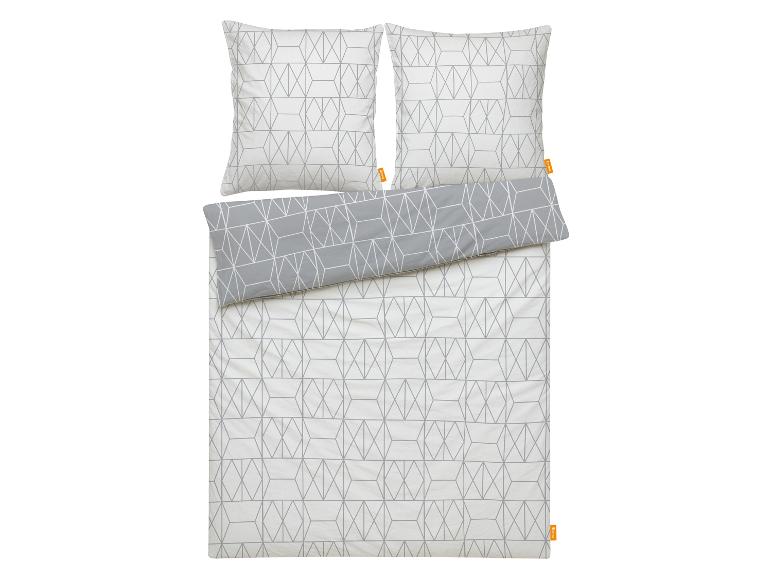 Parure de lit à motif géométrique dans les tons gris et blanc.