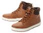 Deux paires de chaussures en cuir marron à lacets.