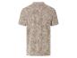Polo beige à motif tropical.