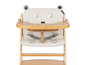 Un rehausseur de chaise Safety 1st blanc avec un design tête d'ours.
