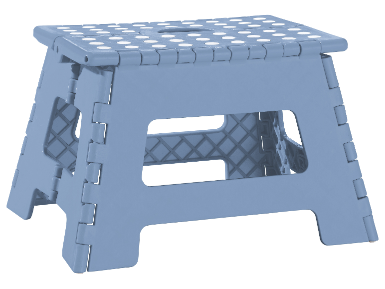Tabouret pliable bleu à pois blancs.