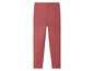 Un legging rose en tricot.