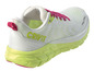 Chaussures de course Crivit blanches avec des lacets roses et une semelle verte.