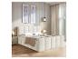Chambre moderne avec lit rembourré crème, tables de chevet et tableaux abstraits.
