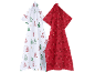 Deux torchons de cuisine de Noël: un blanc avec des sapins et un rouge avec des étoiles.