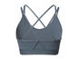 Un soutien-gorge de sport gris avec des bretelles croisées.