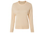 Pull beige à manches longues en tricot.
