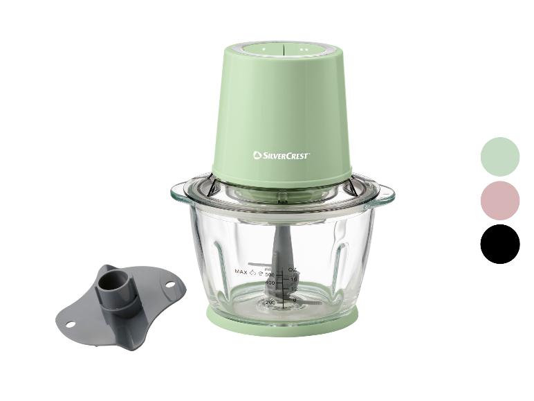 Hachoir électrique vert menthe avec bol en verre et accessoires, avec échantillons de couleurs.