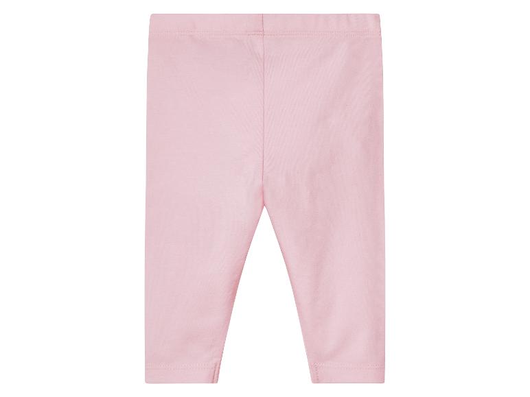 Leggings roses pour bébé en tissu doux.