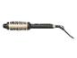 Brosse coiffante avec manche noir et corps doré, dotée de poils noirs.