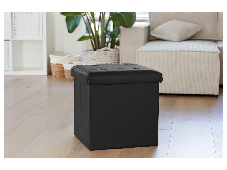 Un coffre de rangement noir avec un siège rembourré.