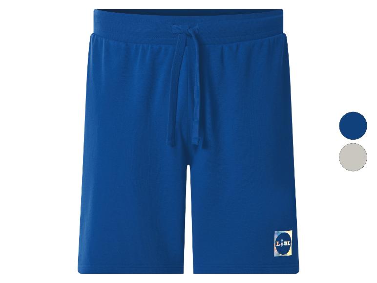 Short de sport bleu avec cordon de serrage à la taille et petit logo sur la jambe.
