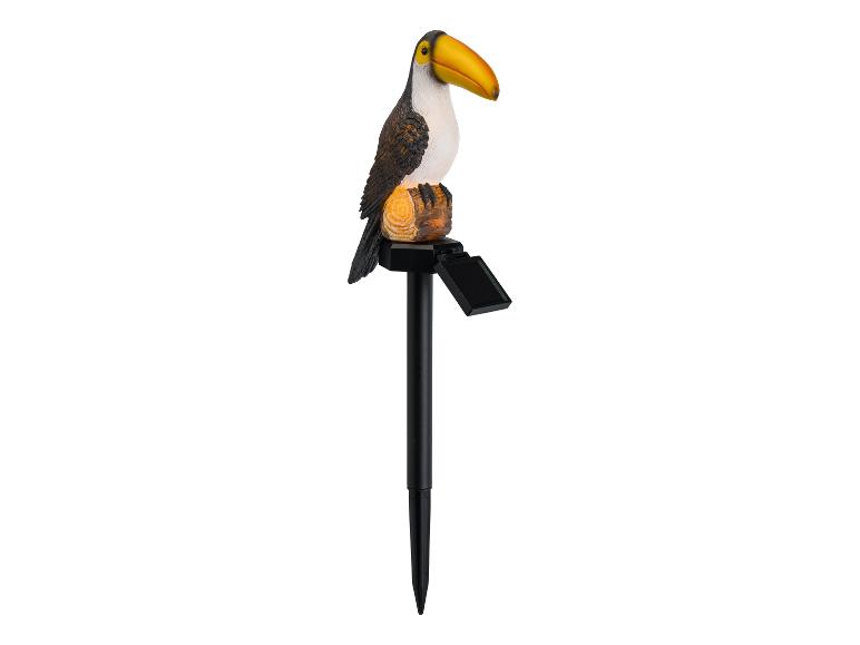 Lampe de jardin solaire en forme de toucan sur un piquet.
