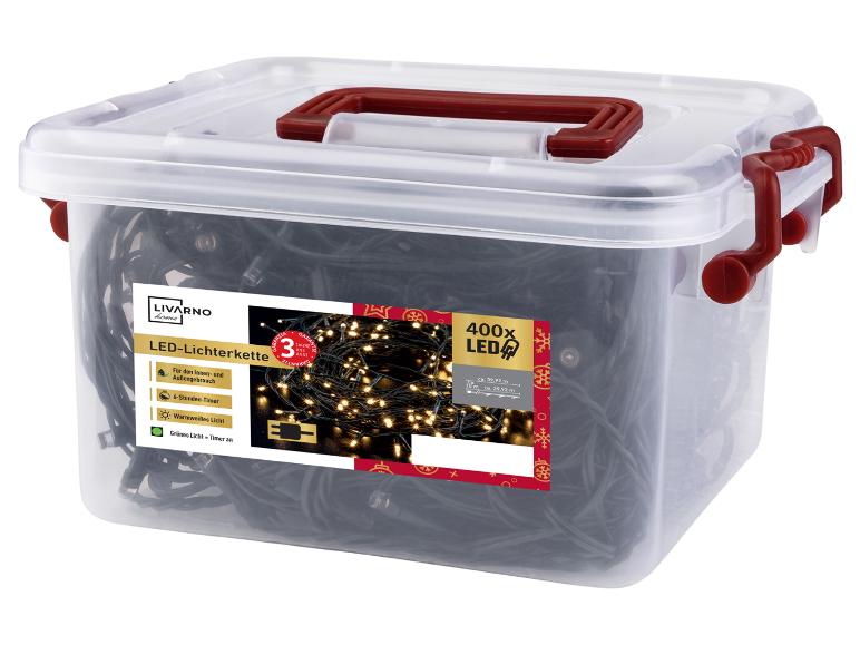 Boîte transparente avec guirlande lumineuse LED Livarno Home, 400 LED, minuterie et lumière blanc chaud.