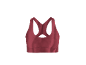 Brassière de sport rouge avec bretelles croisées dans le dos.